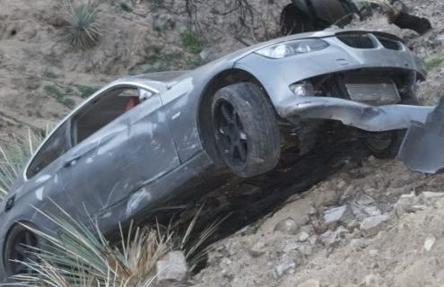 BMW 335i lands on 3 rocks 426 feet down the mountain - Passengers make it out alive