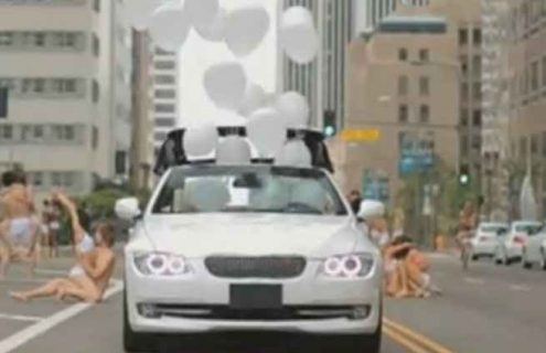 Product Placement: Kylie Minogue surrounds herself with white BMWs