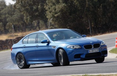 The new F10 BMW M5 drifting in the wet at Nurburgring 